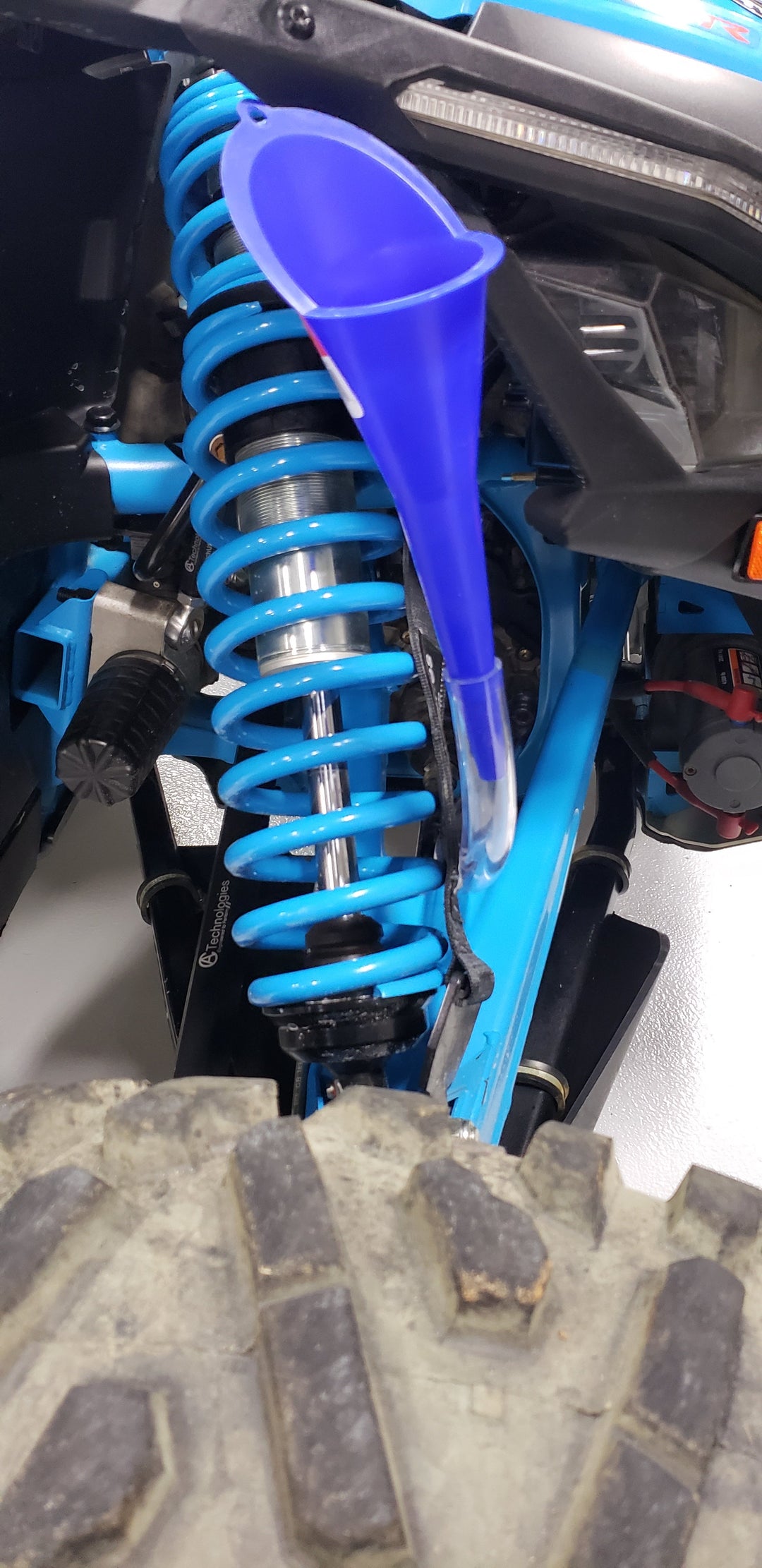 Can-Am X3 Differential Fill Adapter Tool Use the aluminum adapter, thread it into the fluid fill plug where the stock X3 plug is, attach the supplied hose, run to an easy to accessible location and use your favorite funnel in the hose to fill your X3 with fluid. When your done just detach the hose from the adapter, unthread it, and reinstall the plug. It's really that easy.